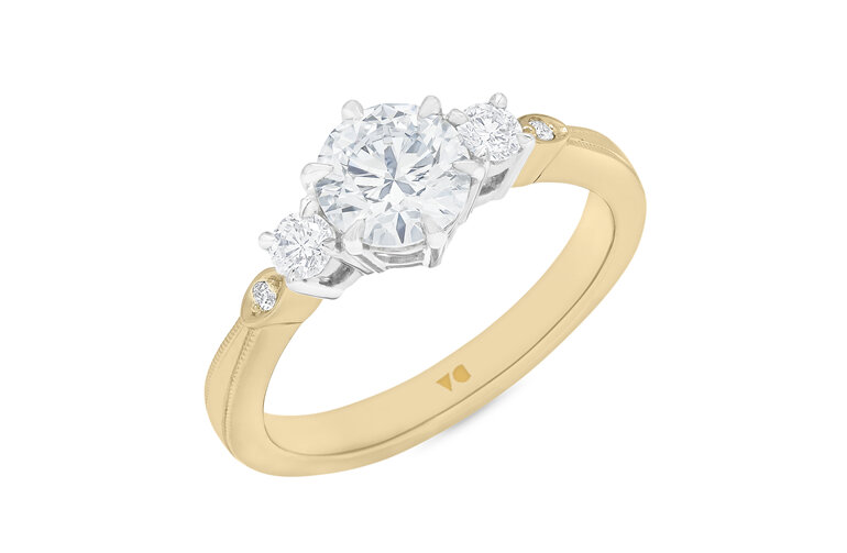 Celtic inspired diamond three stone ring 18ct yellow gold platinum milgrain edge