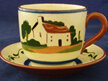 Cup and saucer in motto ware