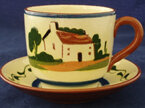 Cup and saucer in motto ware