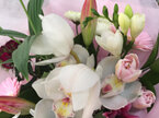 Cymbidium Orchids in water filled Vox