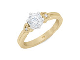 Diamond solitaire engagement ring in 18ct yellow gold platinum koru heart detail