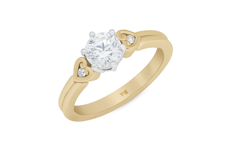 Diamond solitaire engagement ring in 18ct yellow gold platinum koru heart detail