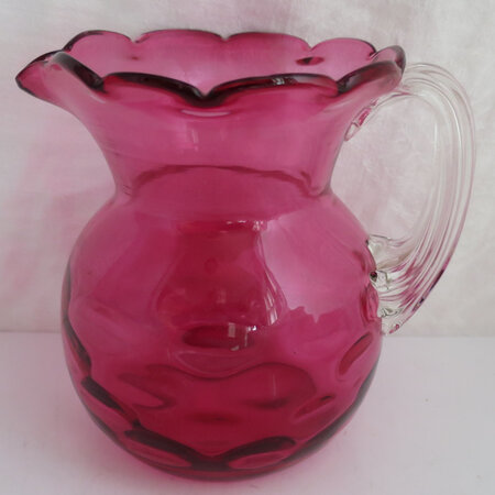Dimpled jug with clear handle