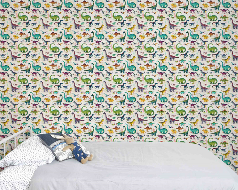 Dinosaur wallpaper in kids room with a bed