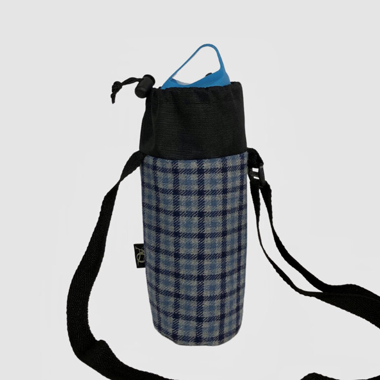 Drink bottle carrier in a water resistant fabric and a blue wool check. NZ made