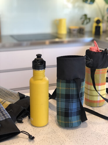 Drink bottle carrier with adjustable strap, made in NZ.