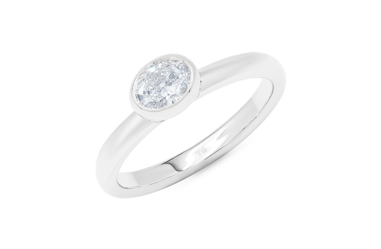 East-west bezel set oval diamond solitaire ring engagement white gold platinum