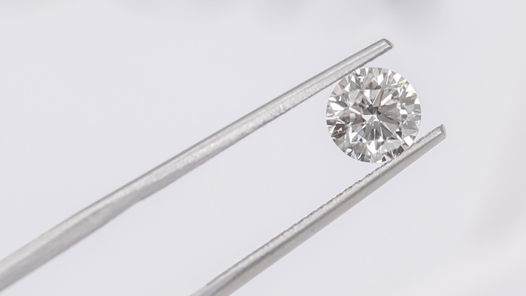 GIA Certified Diamond in Gemstone Tweezers