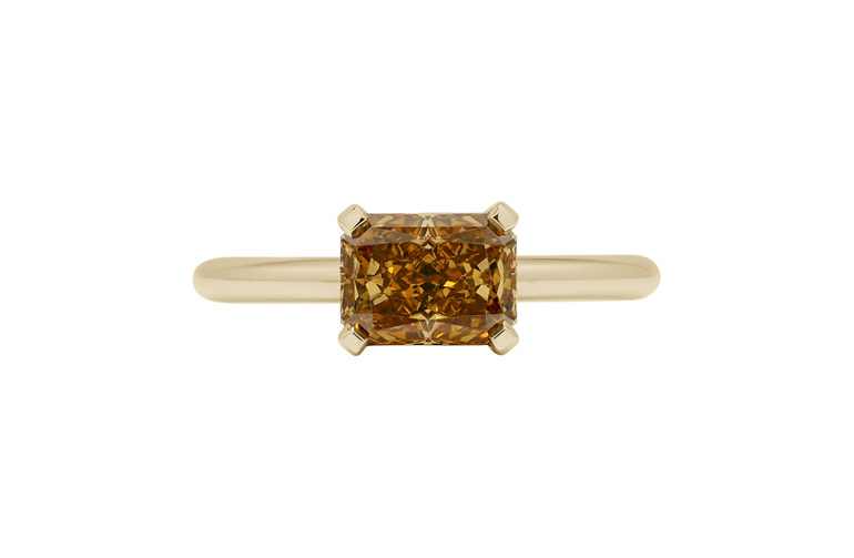 golden orange coloured diamond radiant cut set east-west solitaire ring gold
