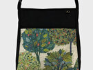 Green leafy trees on the front pocket of the most popular handbag