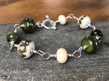 Handmade glass bracelet - jitterbug - ivory/cave green