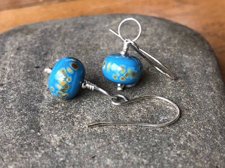 Handmade glass earrings - frit - jitterbug on dark turquoise