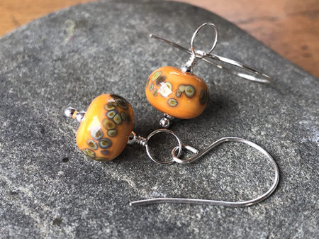 Handmade glass earrings - frit - jitterbug on (old) orange