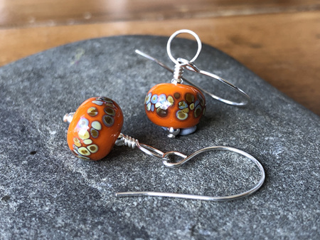 Handmade glass earrings - frit - jitterbug on orange