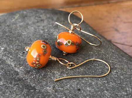 Handmade glass earrings - frit - jitterbug on orange [gold filled]