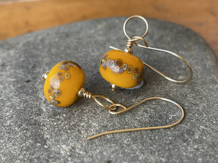 Handmade glass earrings - jitterbug on yellow [Gold-filled]