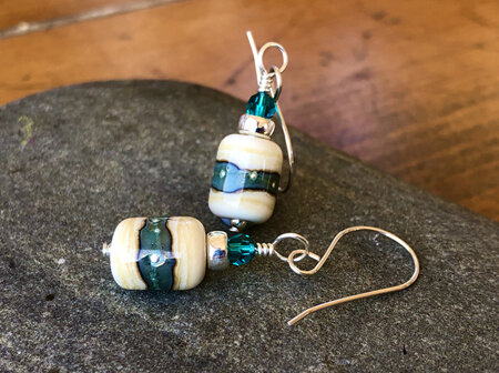 Handmade glass earrings - organic barrels - copper green on ivory