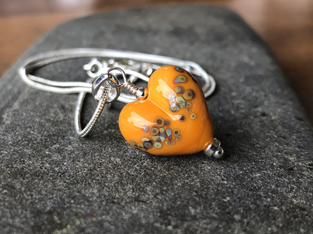 Handmade glass heart pendant - jitterbug on (old) orange