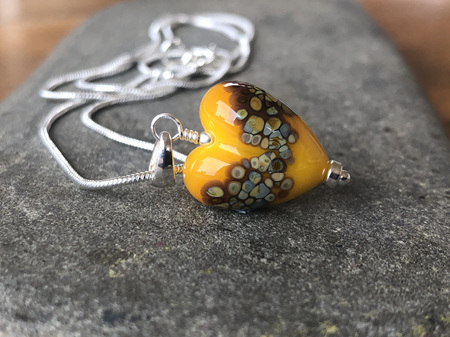 Handmade glass pendant - heart - jitterbug on yellow