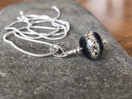 Handmade glass pendant - pure silver trails - sandstone on black