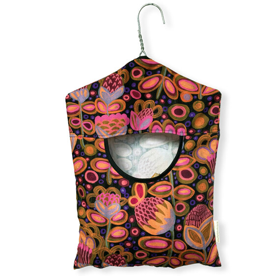 hanging cotton peg bag with bright painted flowers