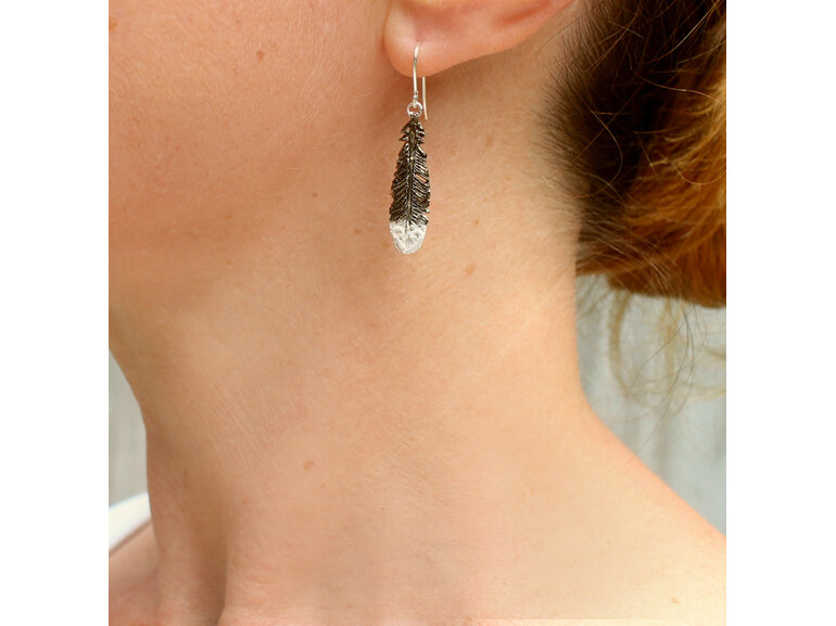 huia feather black white sterling silver native  earrings worn koru lily griffin