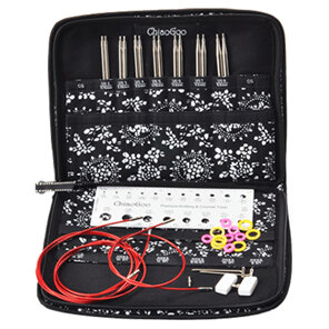 image is a zip up case holding 6 sets of needle tips, red cable, stitch markers