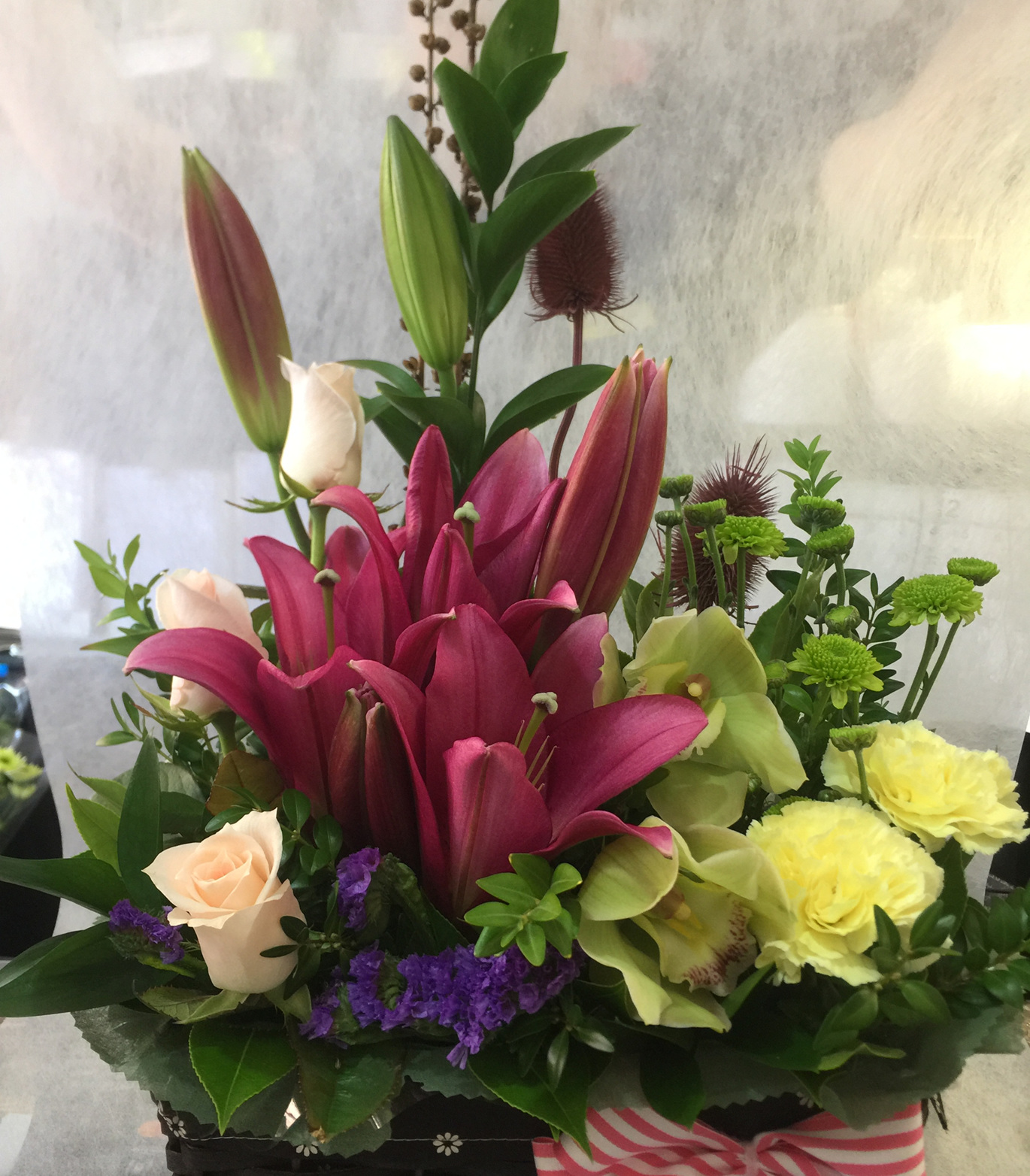 quality flower arrangement in basket.