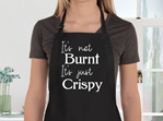 It's not burnt it's crispy funny apron