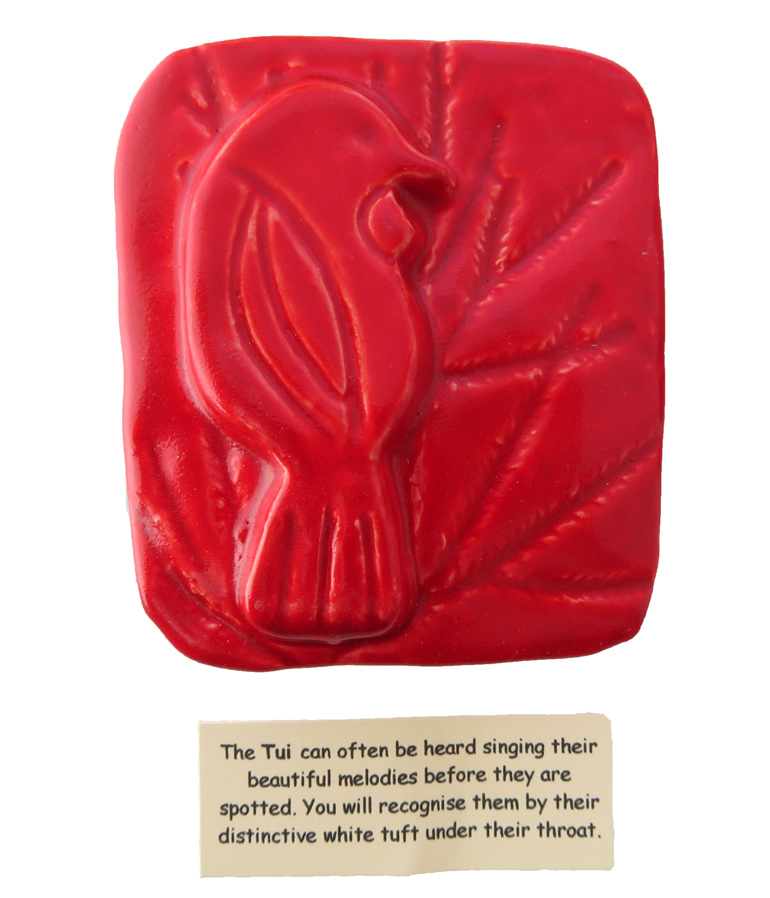Little red ceramic tile of a Tui bird
