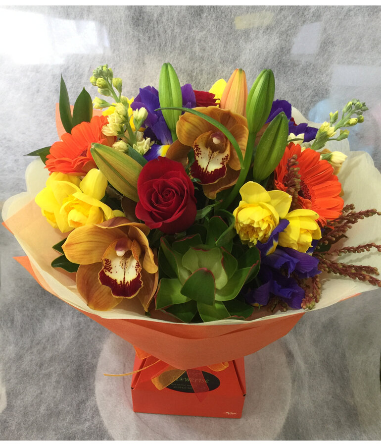 Mixed bouquet presentation in a water filled box Vox
