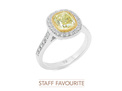 Natural Fancy Yellow diamond framed in yellow gold, surrounded by 44 diamonds