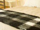 New Zealand Made Alpaca Throw Blanket on Bed