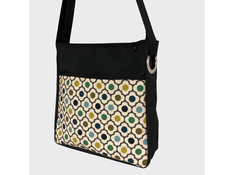 Orla Kiely flower fabric on front pocket of a laptop/work bag