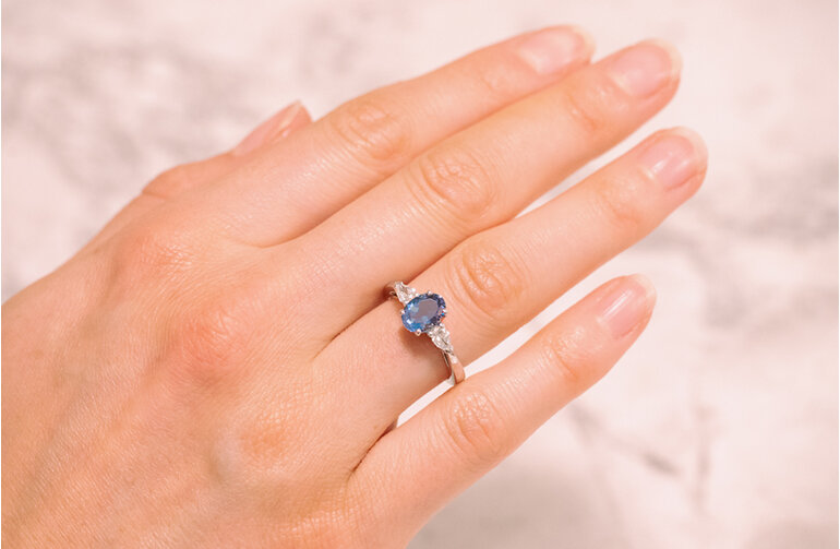 oval blue aquamarine and pear diamond three stone dress ring