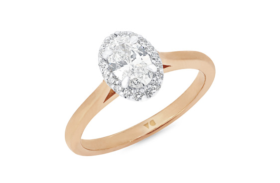 Oval diamond halo engagement ring in 18ct rose gold