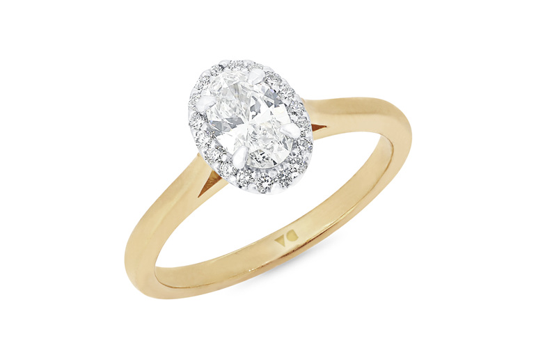 Oval diamond halo engagement ring in 18ct yellow gold