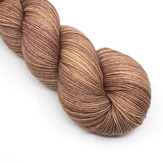 part twisted skein of 4ply yarn in a caramel brown