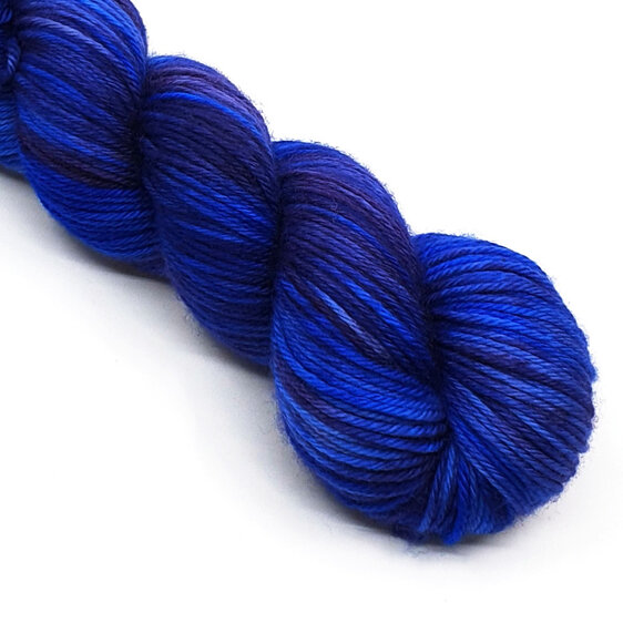 partial skein of DK merino in variegated sapphire blue and lilac