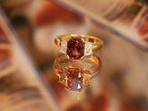 Peach Sapphire and diamond three stone ring crafted in platinum and yellow gold