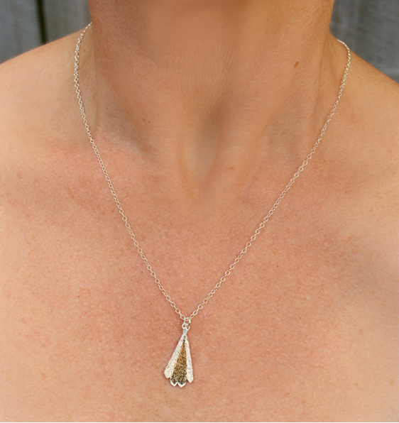 piwakawaka fantail bird feather bronze gold sterling silver necklace worn
