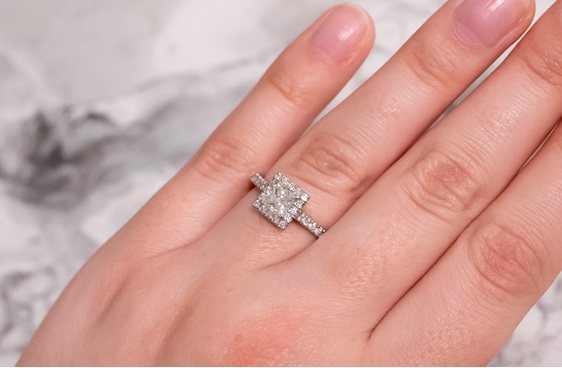 Princess cut diamond halo engagement ring with diamond set band, platinum