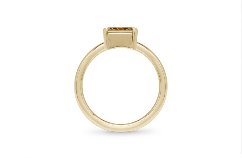 Radiant cut east-west set solitaire ring bezel and prong set yellow gold