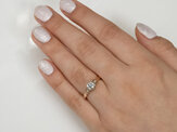 Raumati koru heart rose gold diamond solitaire engagement ring on hand