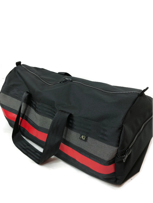 Red, grey and black gear bag and made in NZ