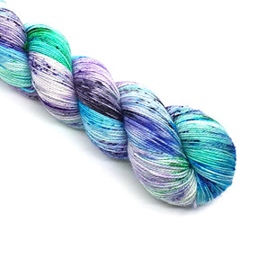 skein 4ply merino/nylon speckled yarn in cream, turquoise, green, purple, black
