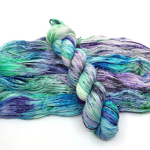 skein 4ply merino/nylon speckled yarn in cream, turquoise, green, purple, black