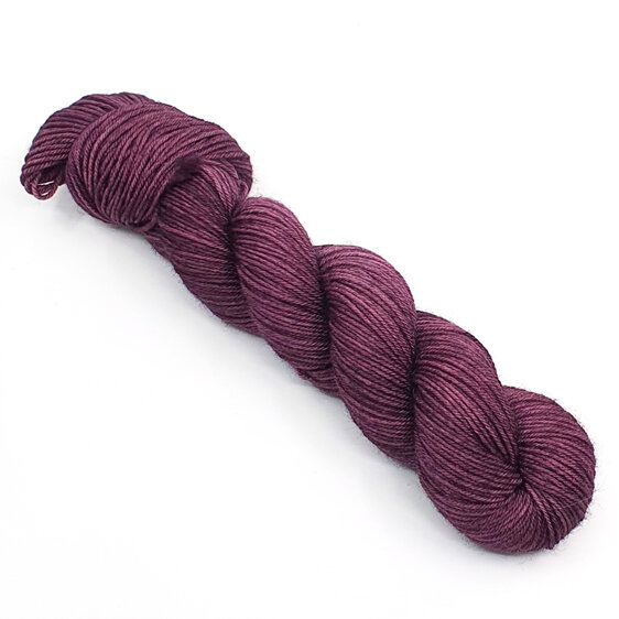 skein of 100% DK Bluefaced Leicester wool in aubergine purple