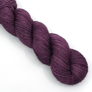 skein of 4ply Bluefaced Leicester wool in aubergine purple