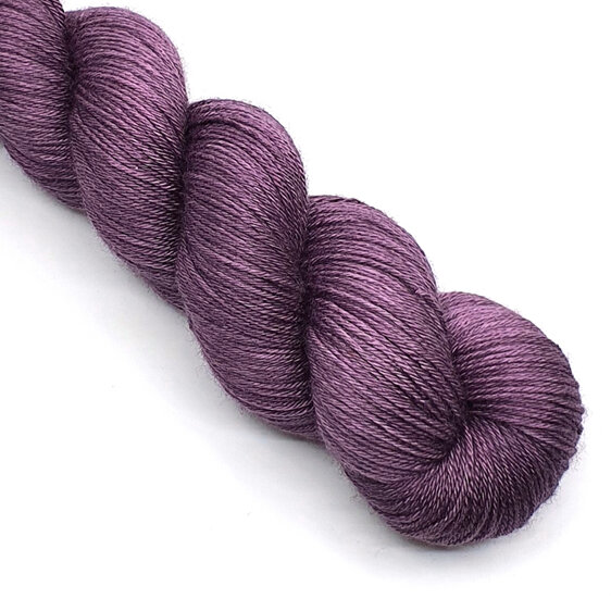 skein of 4ply merino/silk yarn in a aubergine purple